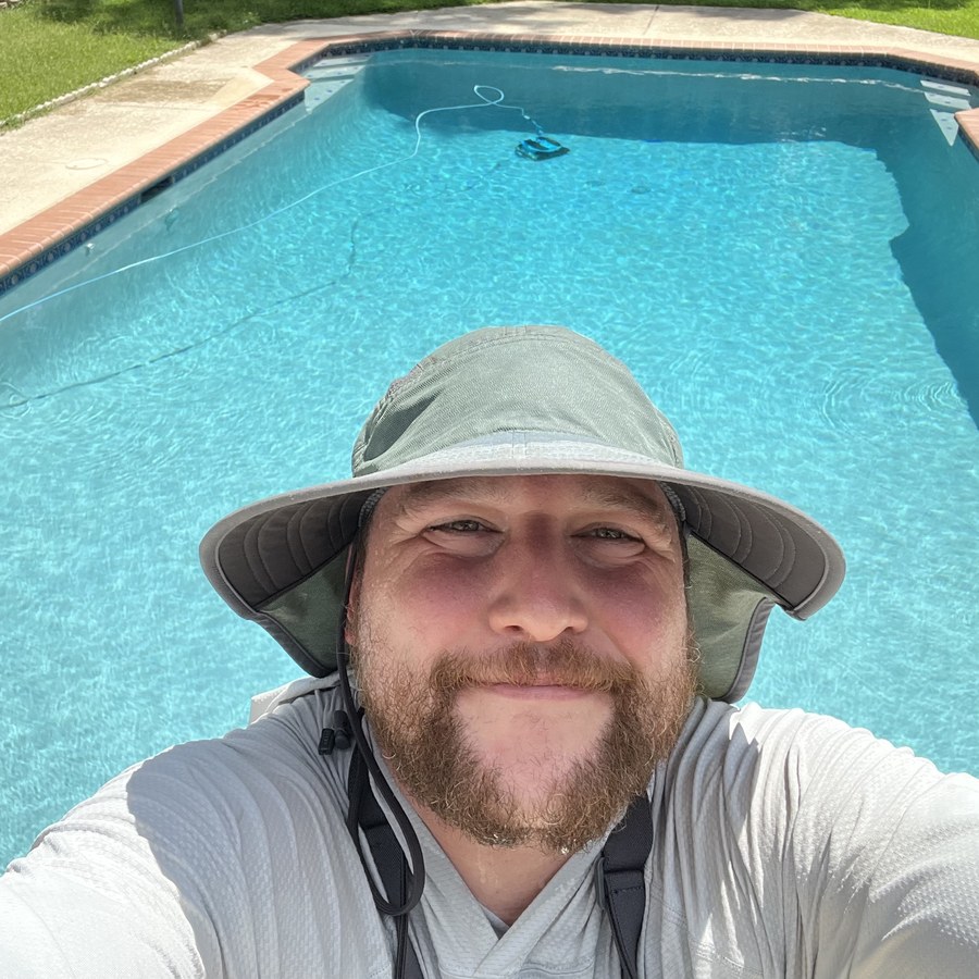 Scotty, owner of Streamline Pools, beside a freshly cleaned pool